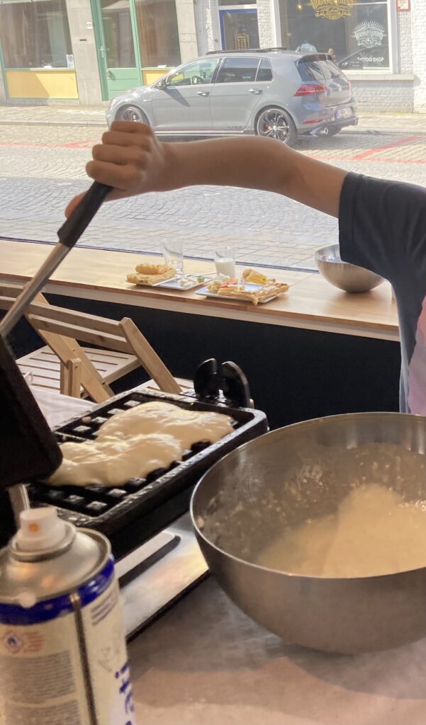 Making waffles at a waffle making workshop in Bruges