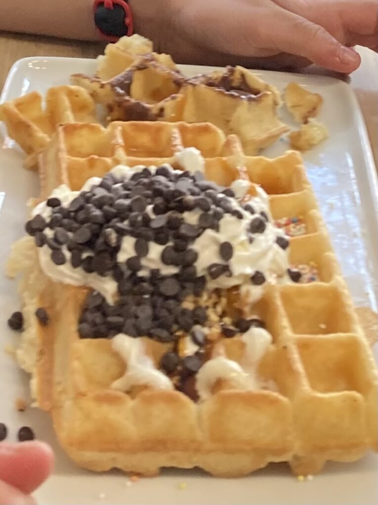 Chocolate sprinkled waffle at a waffle making workshop in Bruges